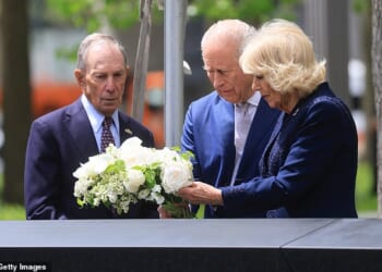 The King and Queen laid a bouquet of flowers on the edge of one of the pools of the 9/11 memorial