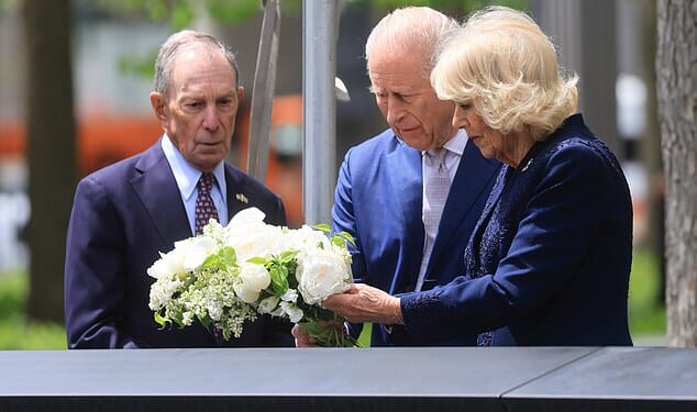 The King and Queen laid a bouquet of flowers on the edge of one of the pools of the 9/11 memorial
