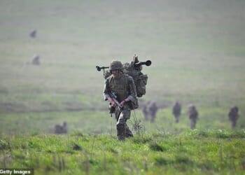 Labour accused of 'dithering' over war footing bill: Plans to bolster UK's defence are delayed until next year despite widespread conflict