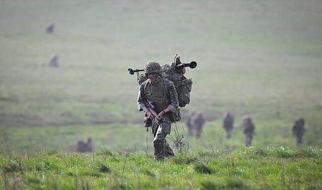 Labour accused of 'dithering' over war footing bill: Plans to bolster UK's defence are delayed until next year despite widespread conflict