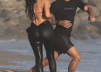 Kim Kardashian was seen making out with Lewis Hamilton for the first time as they were spotted at a beach in Malibu on Tuesday