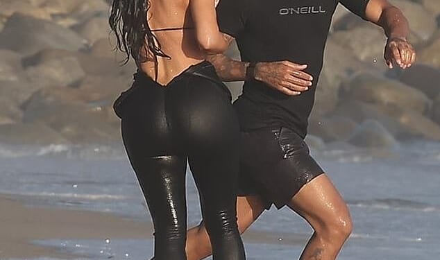 Kim Kardashian was seen making out with Lewis Hamilton for the first time as they were spotted at a beach in Malibu on Tuesday