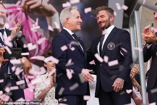 Inter Miami CF managing owner Jorge Mas, left, and co-owner David Beckham, right, stand together during a ribbon cutting ceremony before Inter Miami's first MLS soccer match in Nu Stadium against Austin FC , Saturday, April 4, 2026, in Miami. (AP Photo/Lynne Sladky)