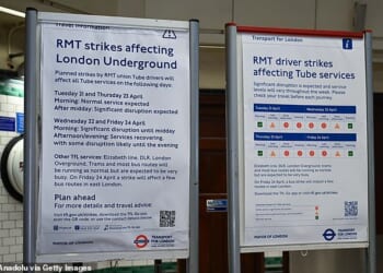 Posters explaining service disruption are displayed at a London Underground station this week