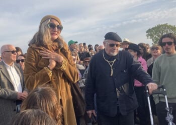 Finbar Sullivan's parents Leah Seresin (left) and Chris Sullivan (centre) join a vigil on Primrose Hill, north London, in memory of the 21-year-old filmmaking student, who was stabbed there in a fight in the early evening on April 7