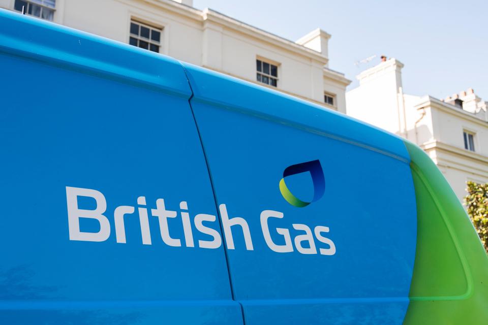 The British Gas logo and name on the side of a blue and green van.