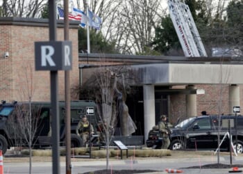 Law enforcement remain on site at the Temple Israel synagogue in West Bloomfield, Michigan, a Detroit suburb, on March 12, 2026, after an assailant drove a vehicle into the building.