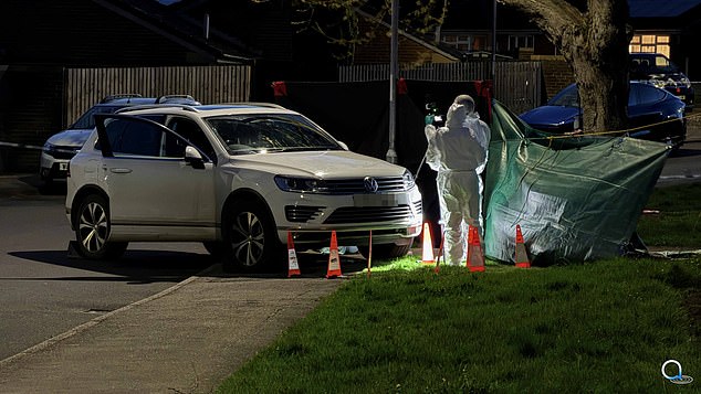 The Volkswagen Touareg could be seen being examined by police after the crash