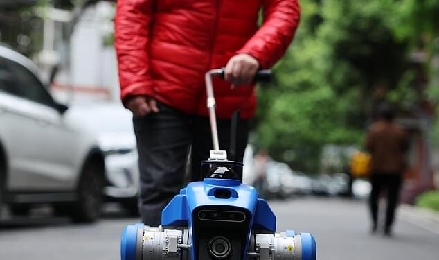 A robot guide dog assists a visually impaired women in Chengdu, China