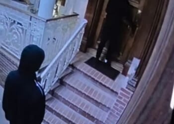 Two men are seen entering the Hollywood Hills home of Margaux Mirkin, 68, on Thursday at around 8pm. Mirkin, the heiress to Budget Rent a Car, was attacked and strangled by the men, according to the Los Angeles Police Department