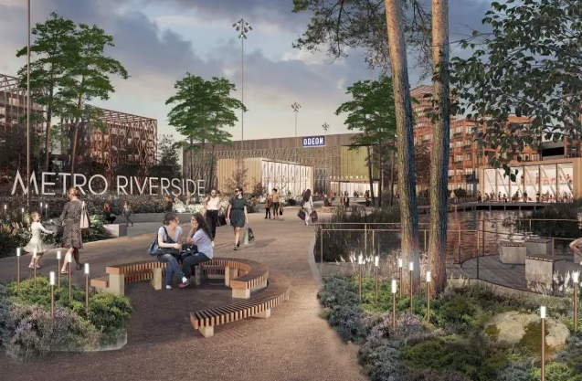 Illustration of a modern urban development called "Metro Riverside" with people walking and sitting, a waterfront, and an ODEON cinema in the background.