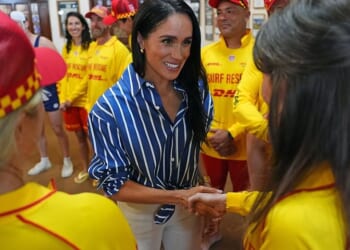 Meghan and Harry thrill Bondi crowds - as pics prove how YOU paid for HER to do iconic coastal walk