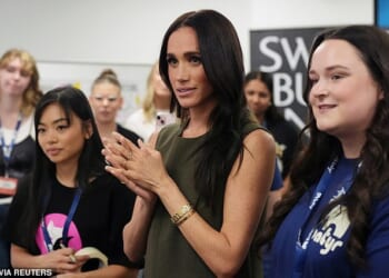 Meghan tells fans she was bullied online 'every day for 10 years' and became 'most trolled person in the world' as Prince Harry suffers awkward selfie moment with Australian TV reporter