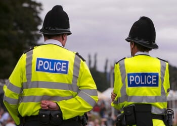 Scotland Yard officers have threatened to sue their 'Big Brother bosses' after an AI programme uncovered hundreds engaged in misconduct and criminality