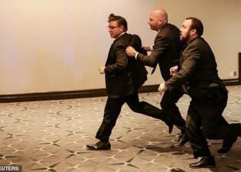 US House Speaker Mike Johnson is evacuated as a shooter opens fire during the annual White House Correspondents' Association dinner in Washington, DC, on April 25, 2026