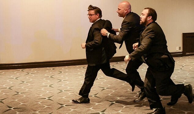 US House Speaker Mike Johnson is evacuated as a shooter opens fire during the annual White House Correspondents' Association dinner in Washington, DC, on April 25, 2026