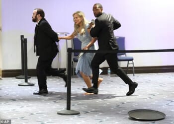 Guests are assisted and whisked away during the White House Correspondents' Dinner shooting aftermath