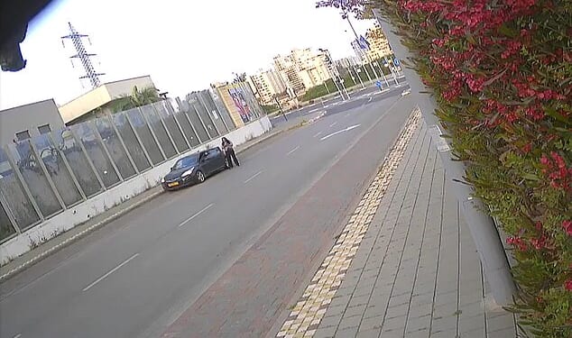 Footage taken early this morning in the Israeli city of Petah Tikva showed the woman getting out of a dark grey car just before 7am local time