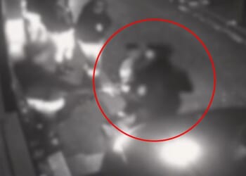 This is the moment a Romanian confidence trickster pretends to be a heartbroken lover before stealing a clubber's £11,000 Rolex watch