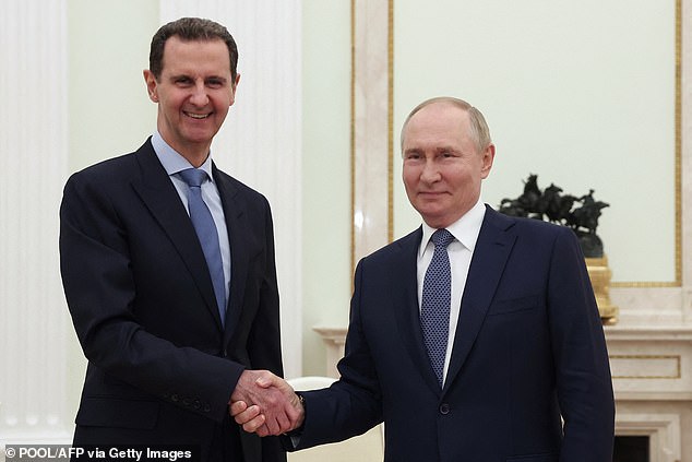 Assad was granted asylum by Vladimir Putin Pictured: Assad met with Putin during a visit to Moscow in 2017, while he was president of Syria