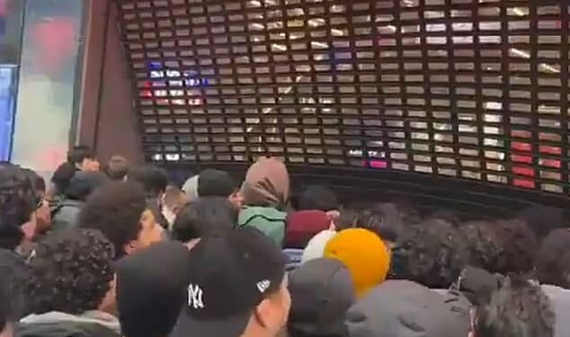 A mob of crazed Pokemon fans forced open the shutters of the flagship Sports Direct store in central London as they stormed inside for new valuable trading cards