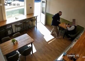 This is the moment a callous knifeman strolls into The Deli café in Bolton, Lancashire, and stabs a diner