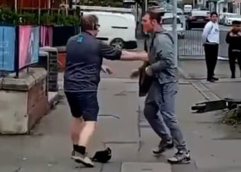 In the footage, filmed outside a Co-op store in Swansea, a man dressed in a grey tracksuit can be seen tussling with a member of staff from the store