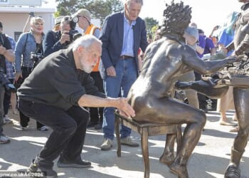 Sally Jones, the daughter of the funny man, who died in 2020, encouraged supporters of the comedy troupe to make the cheeky gesture. Pictured: Jones's Python co-star Terry Gilliam touches the statue's backside