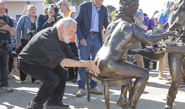 Sally Jones, the daughter of the funny man, who died in 2020, encouraged supporters of the comedy troupe to make the cheeky gesture. Pictured: Jones's Python co-star Terry Gilliam touches the statue's backside