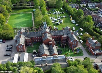 Pictured is Webb House, the Cheshire headquarters of the Ahmadi Religion of Peace and Light (AROPL). Dozens of police cars can be seen swooping on the compound