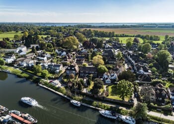 The Home Office has been placing migrants in the quintessentially English village of Laleham in Surrey (pictured)