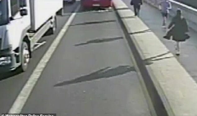Police released dramatic CCTV footage of the moment a jogger appeared to push a woman into the path of an oncoming bus in Putney at about 7.40am on Friday May 5, 2017