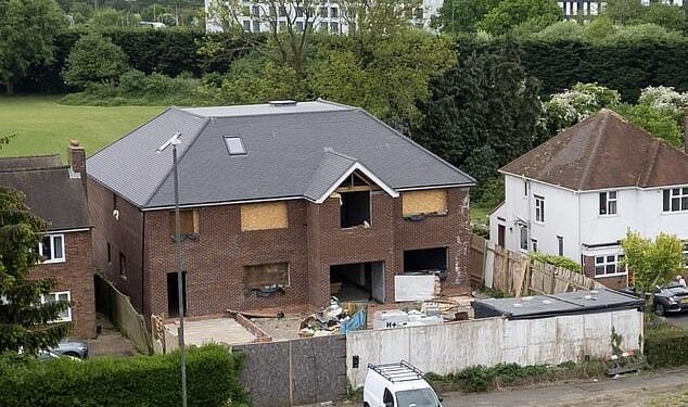 A six-bed newbuild mansion in High Wycombe has not been demolished after an enforcement notice was issued. It is pictured in May last year