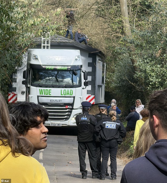 A static caravan, being transported on the back of a lorry, got stuck on a major country road in the village on Sunday