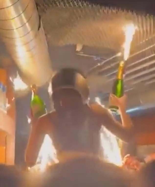 Screen grab from a previously released video reveals the moment the packed Swiss nightclub burst into flames after a waitress hoisted champagne bottles topped with sparklers beneath a low ceiling