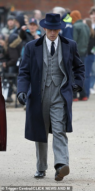 Dressed perfectly for the 1950s set series Jamie wore a sharp three piece suit with a long navy coat