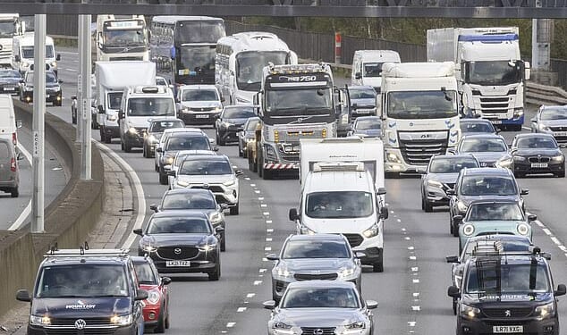 Heavy traffic is seen on the M25 near Egham in Surrey as many travellers' Easter getaway begins - with motoring organisations predicted this year's would be the busiest since 2022