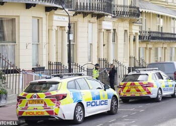 Police outside Moon's Lodge hostel in Regency Square, Brighton, where a 37-year-old man was found stabbed to death