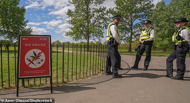 In preparation for the annual event, there was a 'no drugs' sign in the park as officers stood nearby