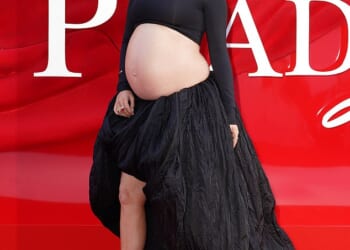 Pregnant Laura Whitmore showed off her bare baby bump in a black crop top and skirt as she attended the Devil Wears Prada 2 premiere in London on Wednesday
