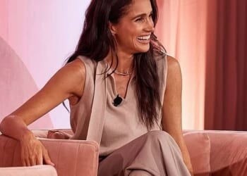 Prince Harry wasted no time in escaping Meghan Markle's controversial Her Best Life retreat in Sydney. Pictured: Meghan on stage at the Intercontinental Coogee on Friday