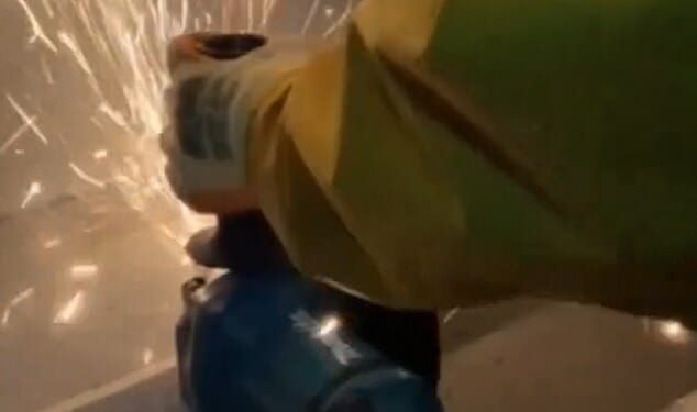 Members of People Against Genocide were filmed cutting into large sections of the metal sheeting on the roof with electric saws at UAV Tactical Systems in Leicester