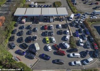 Long queues for fuel are seen at a Costco petrol station in Manchester today