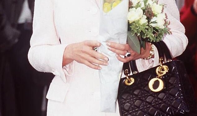 It was a design loved by Princess Diana, and now Queen Camilla has been spotted carrying the Lady Dior bag (Diana is seen wearing the bag in London, 1996)