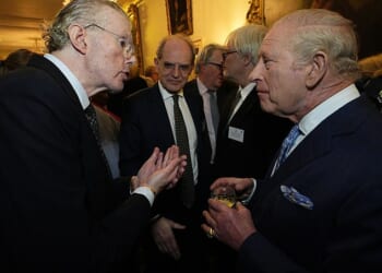 King Charles III speaks to Swedish billionaire Hans Kristian Rausing at Clarence House, London, during a reception to celebrate the first recipients of the Queen's Reading Room Medal – March 25, 2026