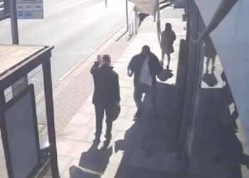 Video obtained by the Daily Mail the suspect in yesterday's terror attack rushing a man waiting at a bus stop and frantically knifing him before two heroic members of the public run towards him