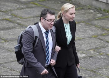 Christopher Trybus pictured arriving at Winchester Crown Court alongside his second wife Beata Wheelhouse