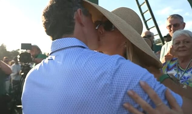 Rory McIlroy kisses his wife Erica Stoll after winning a historic second Masters in a row