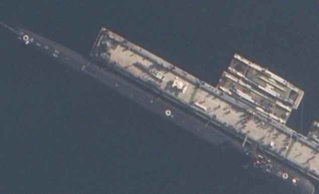 A satellite image released by the MoD of a spy sub seen in British waters last month