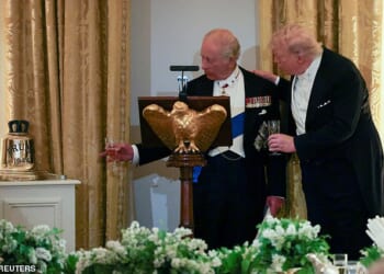 King Charles III presents US President Donald Trump with a large gold bell from HMS Trump